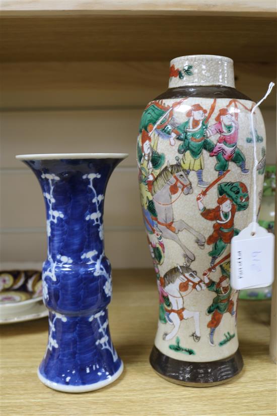 A Chinese blue and white Gu vase, decorated with prunus blossom and a crackleware vase, H 20cm & 29cm